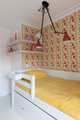 A lively children’s bedroom designed by Claudia Dorsch, featuring Cactus Flower fabric in Fuchsia. A joyful space brought to life with bright pinks, sunny yellows, and playful pattern.